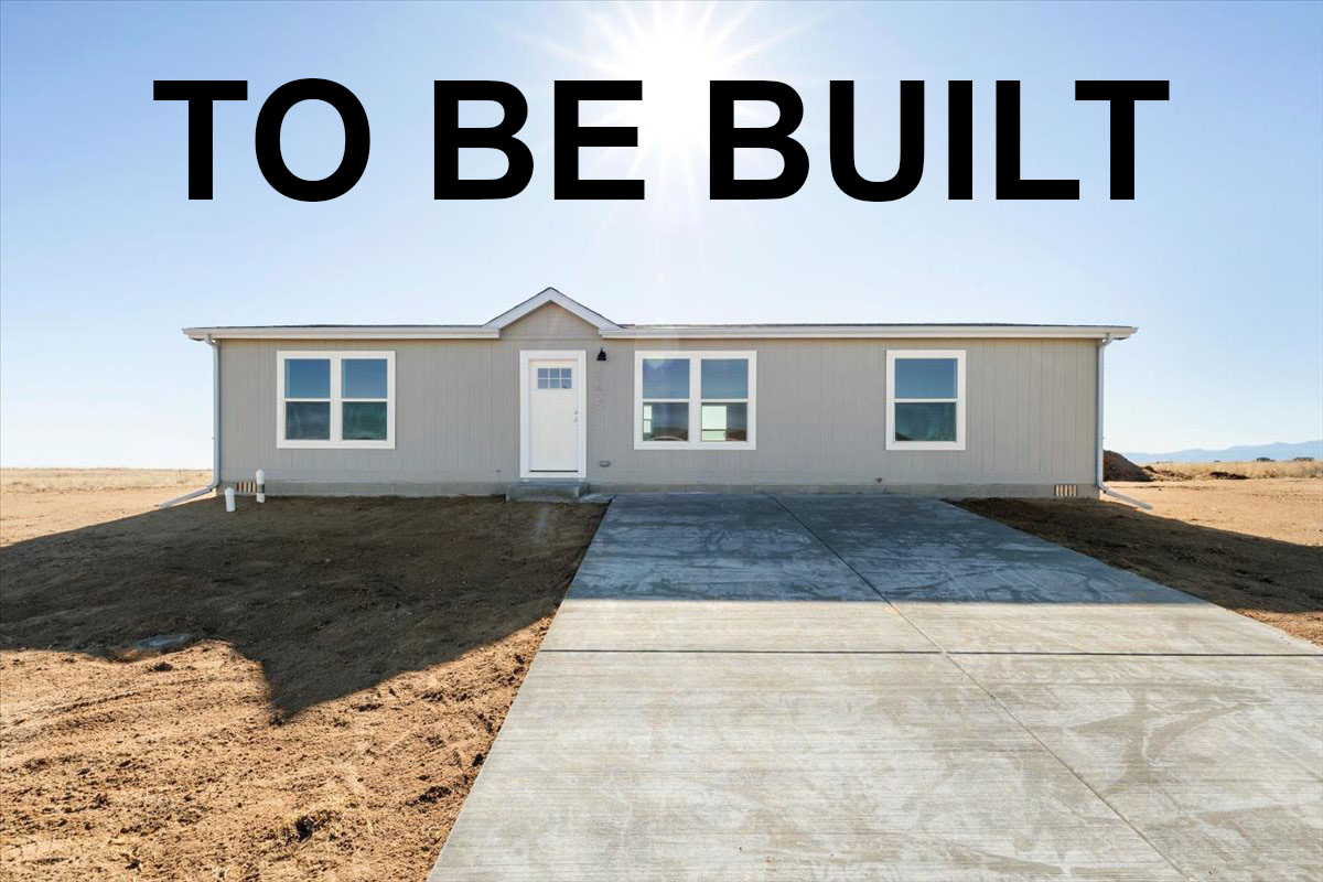 Tan house with a white front door. There is a cement driveway. It is blue sky above the house. The words "To Be Built" are overlayed on the photo.